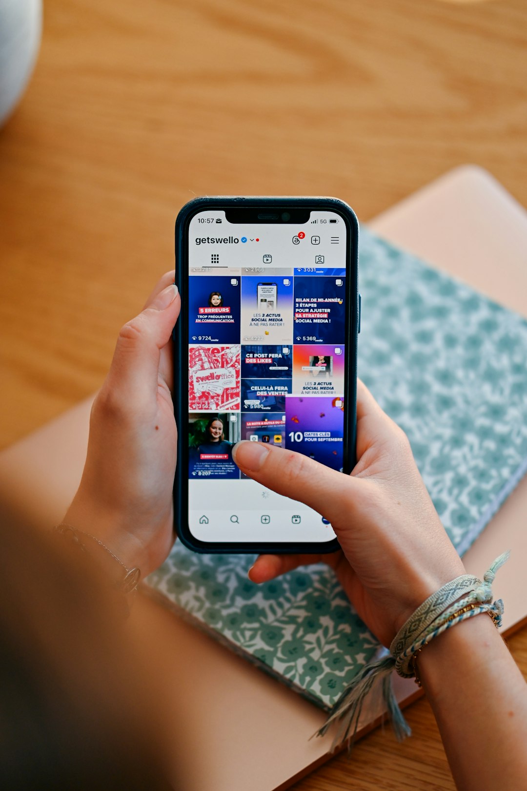 hands-holding-phone-displaying-social-media-feed-7ljc7nkjncc